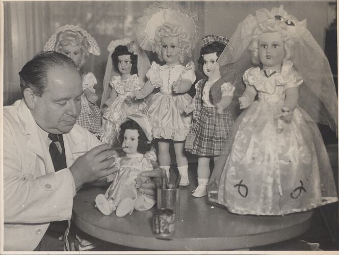 Photograph - L. J. Sterne Doll Co., Leo Sterne Painting Lips on Doll, Melbourne, Oct 1953