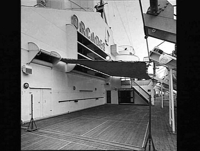 Onboard ship deck. Ship name, Orcades, on left.