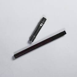 Pencil with painted wooden shaft and and silver metal removable top.