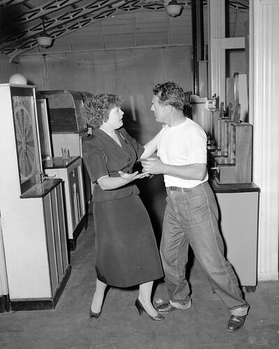 Man and Woman with Gaming Machines, Melbourne, Victoria, 1956