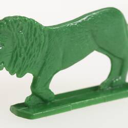 Green plastic toy lion.