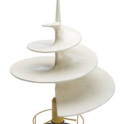 Wooden model with corkscrew style blade painted white with yellow and brown base with metal yellow railing.