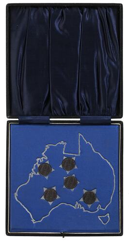 Black hinged case with blue textile lining. The inner base is blue cloth with silver map and stars.