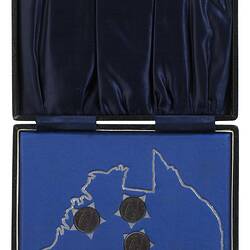 Black hinged case with blue textile lining. The inner base is blue cloth with silver map and stars.