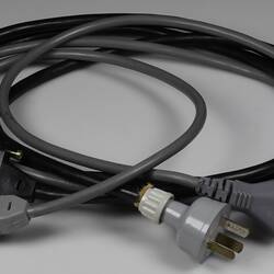 Two power cords for a computer.