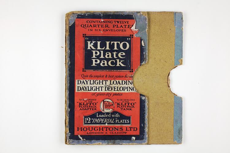 Flattened box with red and blue label.