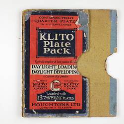 Flattened box with red and blue label.