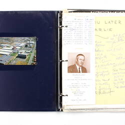 Open plastic ringbinder with paper and photographs inside.