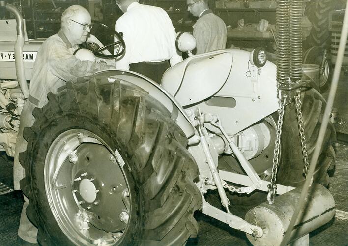 Man testing tractor hydraulics.