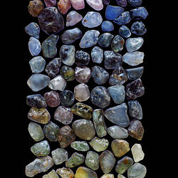 Large number of uncut sapphires of various colours.