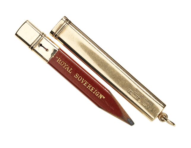 Rectangular lead pencil with gold capping at end. Has fitted gold case it slides into. Pencil has gold lettering.