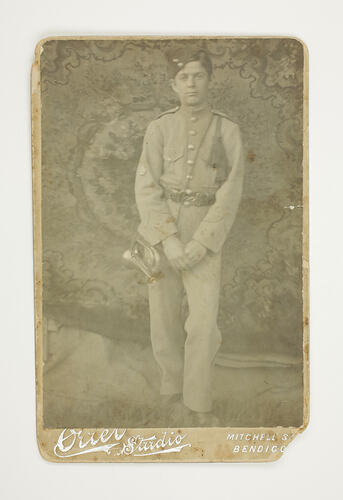 Soldier with bugle in studio.
