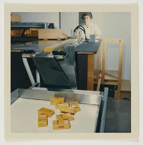 Slide 161, 'Extra Prints of Coburg Lecture', Worker Operating Packaging Conveyor Belt, Kodak Factory, Coburg, circa 1960s