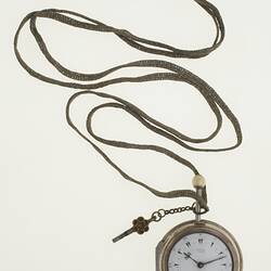 Gentleman's pocket watch in case and attached to silver plaited chain.