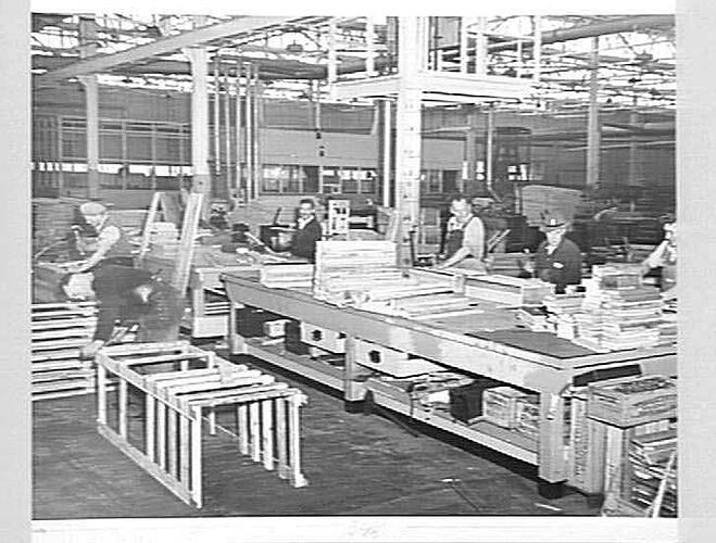 Sawmill workers making wooden crates.