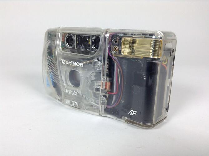 Camera with clear case showing internal parts. Angle view.