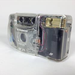 Camera with clear case showing internal parts. Angle view.