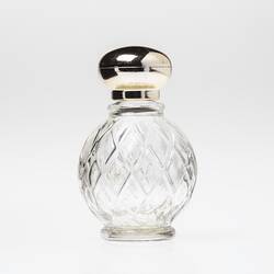 Clear round glass perfume bottle, diamond faceting. Plastic gold screw lid.