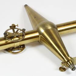 Brass scientific instrument, overhead view.
