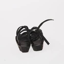 Black rubber miniature sandals.