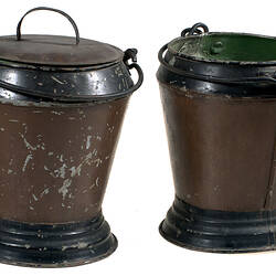 Side view of two metal buckets.