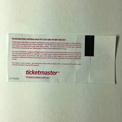 Back of white ticket with red printed text.