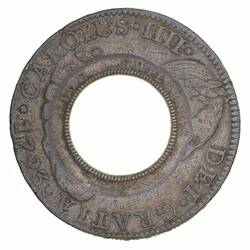 Coin with central hole. Lettering around. Dotted border.