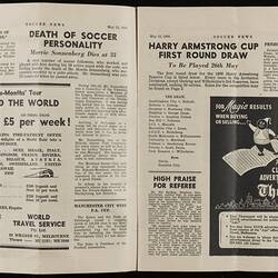 Open magazine with white pages and black printed text and images.