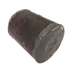 Side view of metal jam tin grenade.