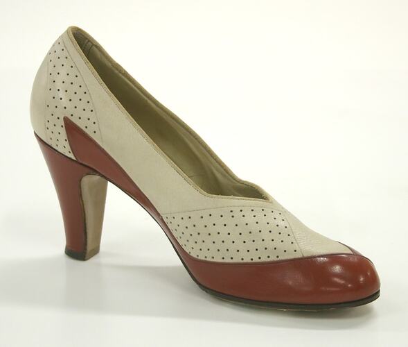 White and tan leather women's shoe.