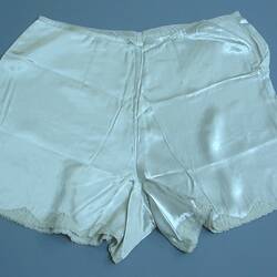 Woman's grey satin underpants. Lace trim on legs.