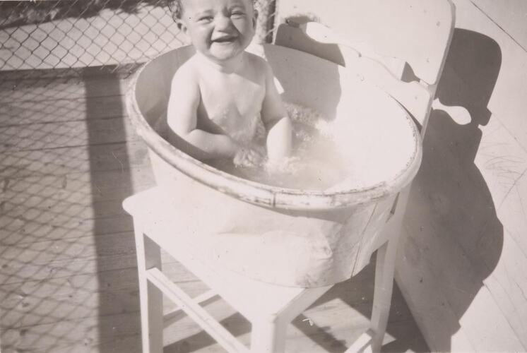 Digital Photograph - Baby Laughing in Bath on verandah, Deepdene, 1950