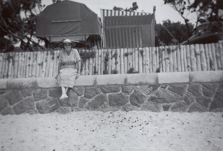 Digital Photograph - Woman Sitting on Foreshore Retaining Wall, by Camp Site, Rye, circa 1960