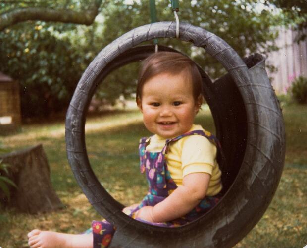 Digital Photograph - Infant Girl in Tyre Swing, Backyard, Noble Park, circa 1979