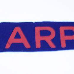 Blue and red ARP amrband.