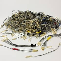 Pile of electrical wires with small metal pins at the ends.