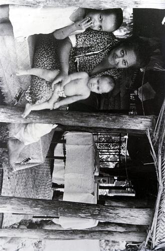Negative - Woman with Two Children in Hut, Fiji, circa 1920s