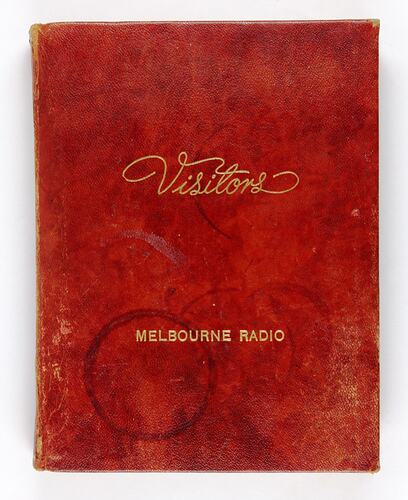 Red "Visitors" book for Melbourne radio with coffee rings