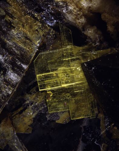 Sheet-like yellow crystals.