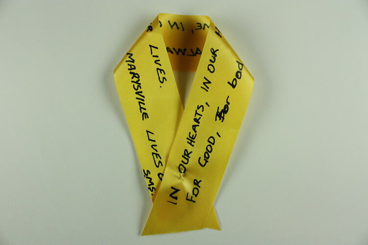 Yellow ribbon with text.