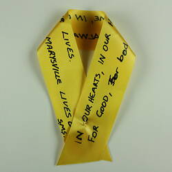 Yellow ribbon with text.