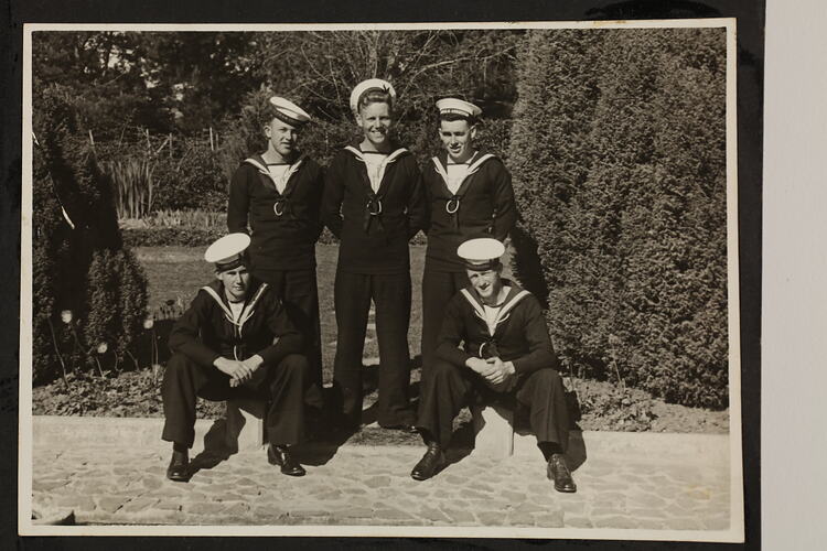 Group portrait of five Seamen with three standing and two kneeling either side.