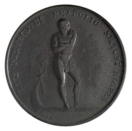 Round medal with male statue. Text around.