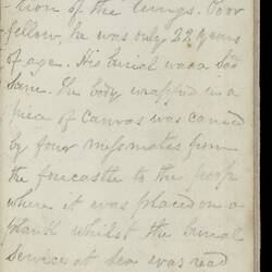Open diary with handwritten text on discoloured worn page.