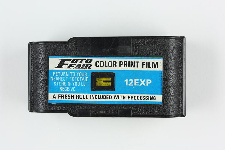 Embossed plastic film cartridge with label.