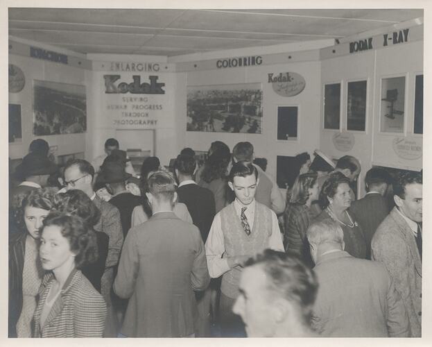 Oblique view of crowd in photographic product exhibition.