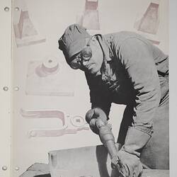 Man using hand tool to finish pipe fitting.