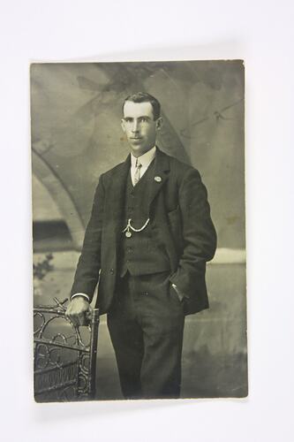 Three-quarter portrait of man in suit and tie.