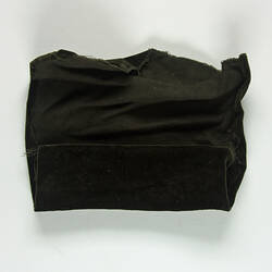 Rolled piece of brown velvet.