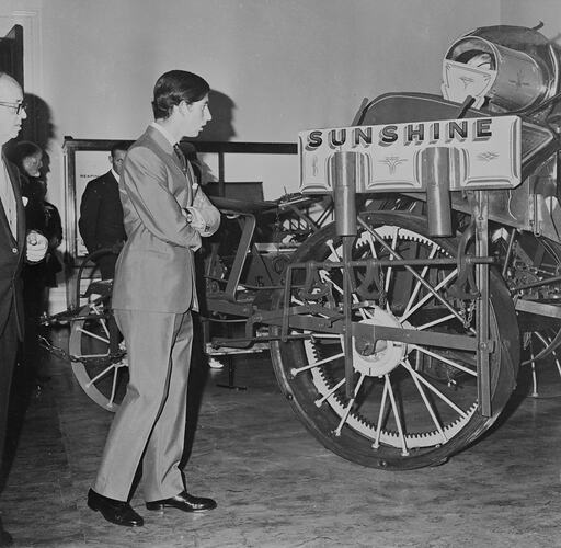 Prince Charles (Prince of Wales) observing the McKay Harvester and displays, Science Museum, Melbourne, 1970